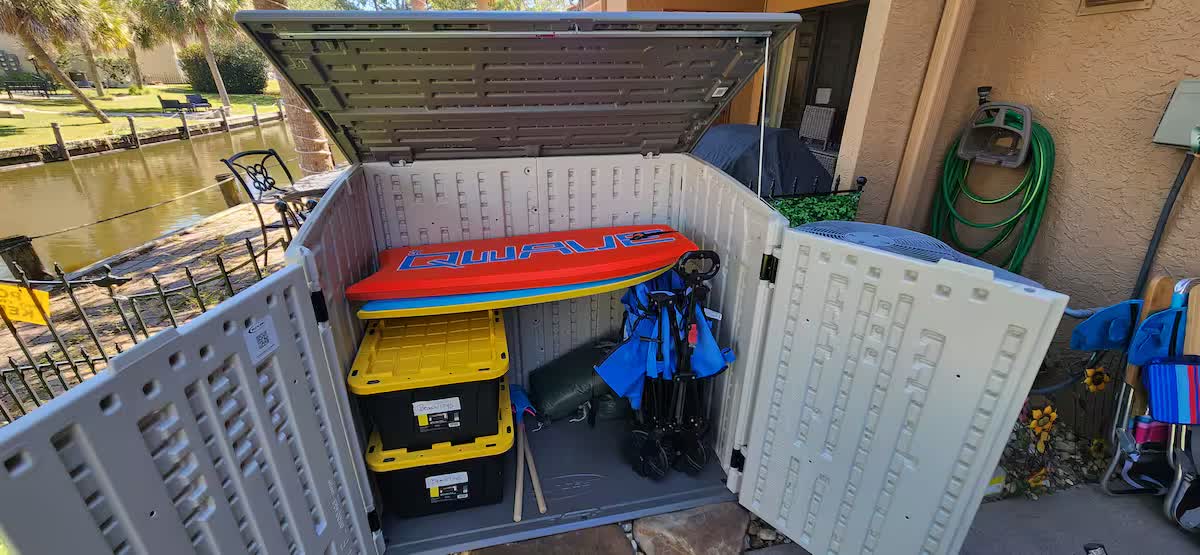Storage box with body boards, beach chairs, and beach gear