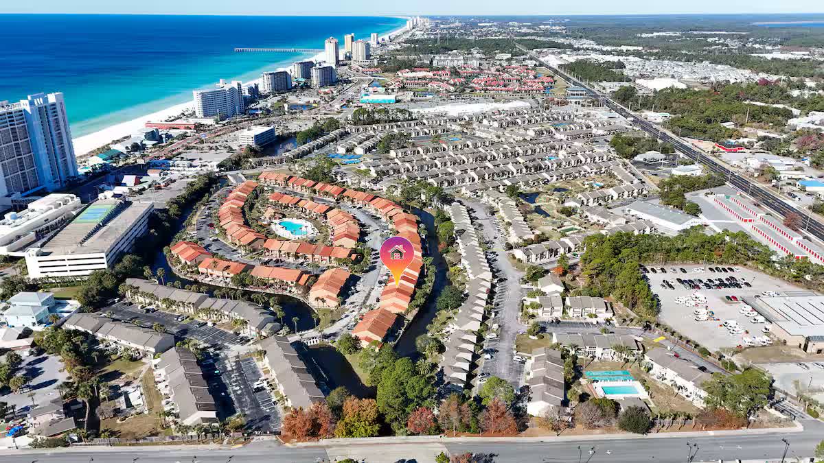 Wide aerial view of Gulf Highlands Beach Resort along the Panama City Beach shoreline